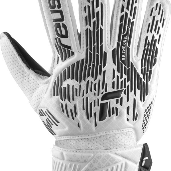 Backhand view of the Reusch Attrakt Solid Black/White goalkeeper glove showing the white and black embossed backhand design with elastic wrist strap.