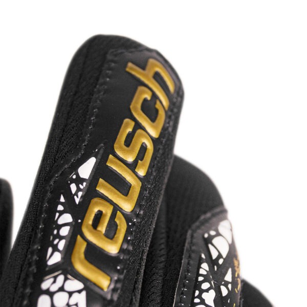 Close-up of the Reusch Attrakt Gold NC Finger Support goalkeeper glove showing the embossed Reusch branding and textured backhand design.