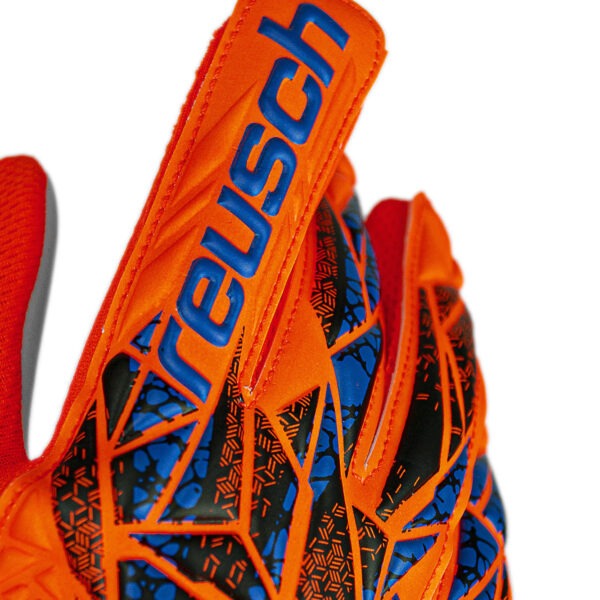 Close-up of the Reusch Attrakt Starter Grip goalkeeper glove showing the embossed Reusch branding and textured backhand design.