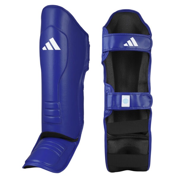Front and inner view of the Adidas WAKO Pro shin guards with integrated in-step protection in blue featuring hook-and-loop straps, cushioned lining, and WAKO approved label.